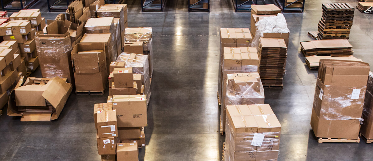 retail boxes stacked on warehouse floor