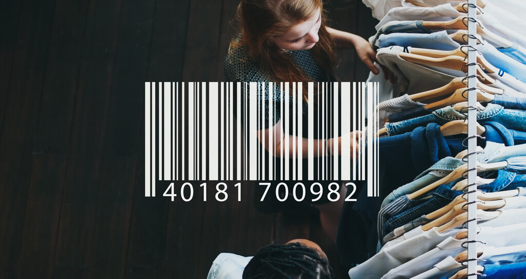 A retail employee scans barcode via IoT technologies and tracking software